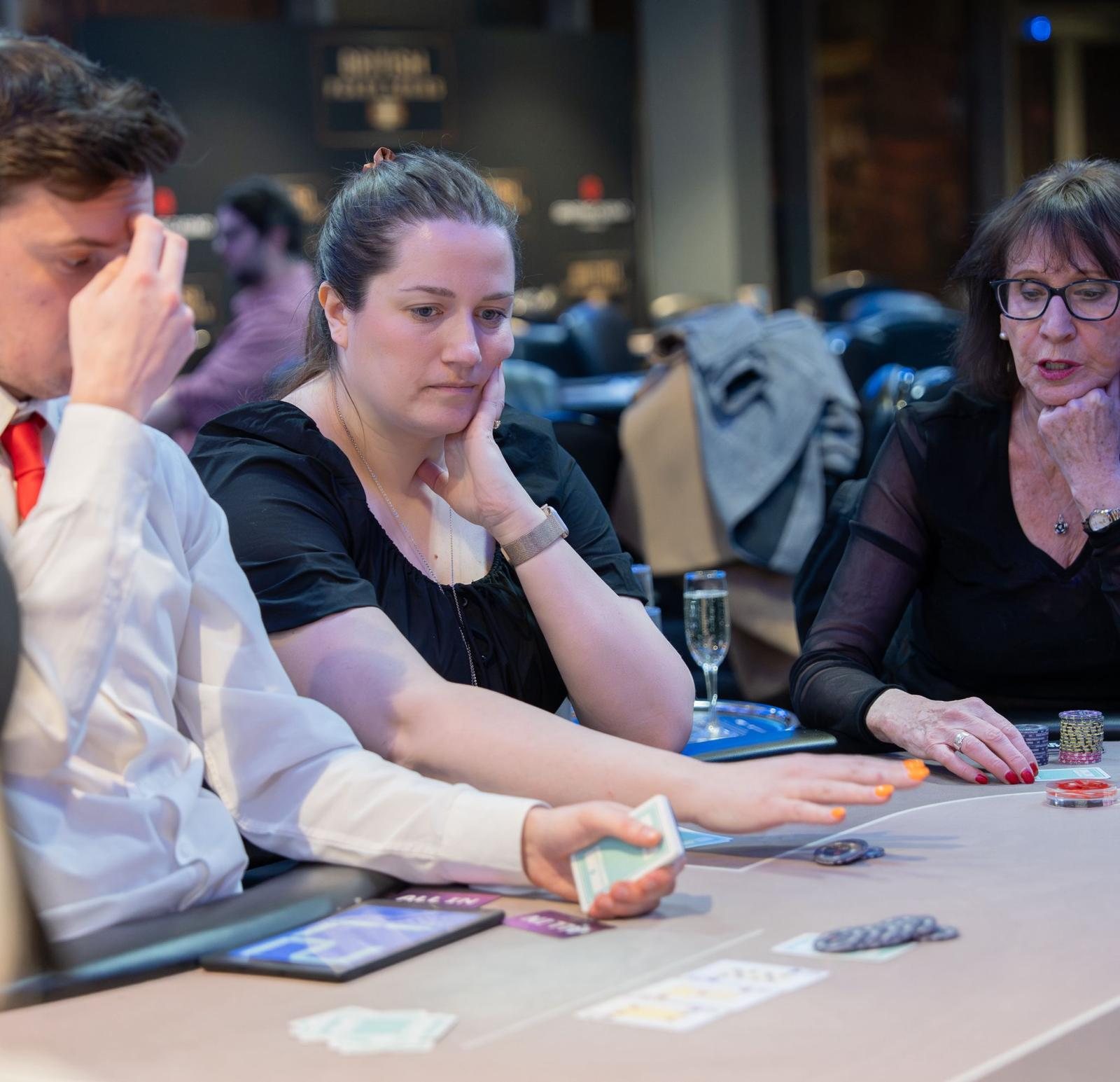 BPS Ladies player handling cards at the poker table