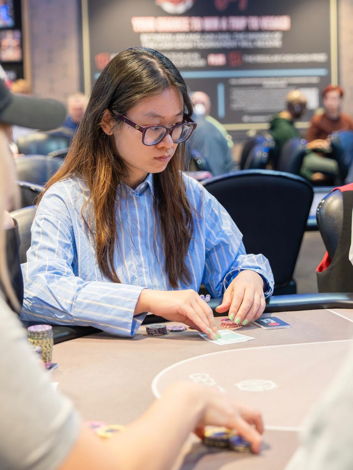 BPS Ladies player stacking chips during tournament play