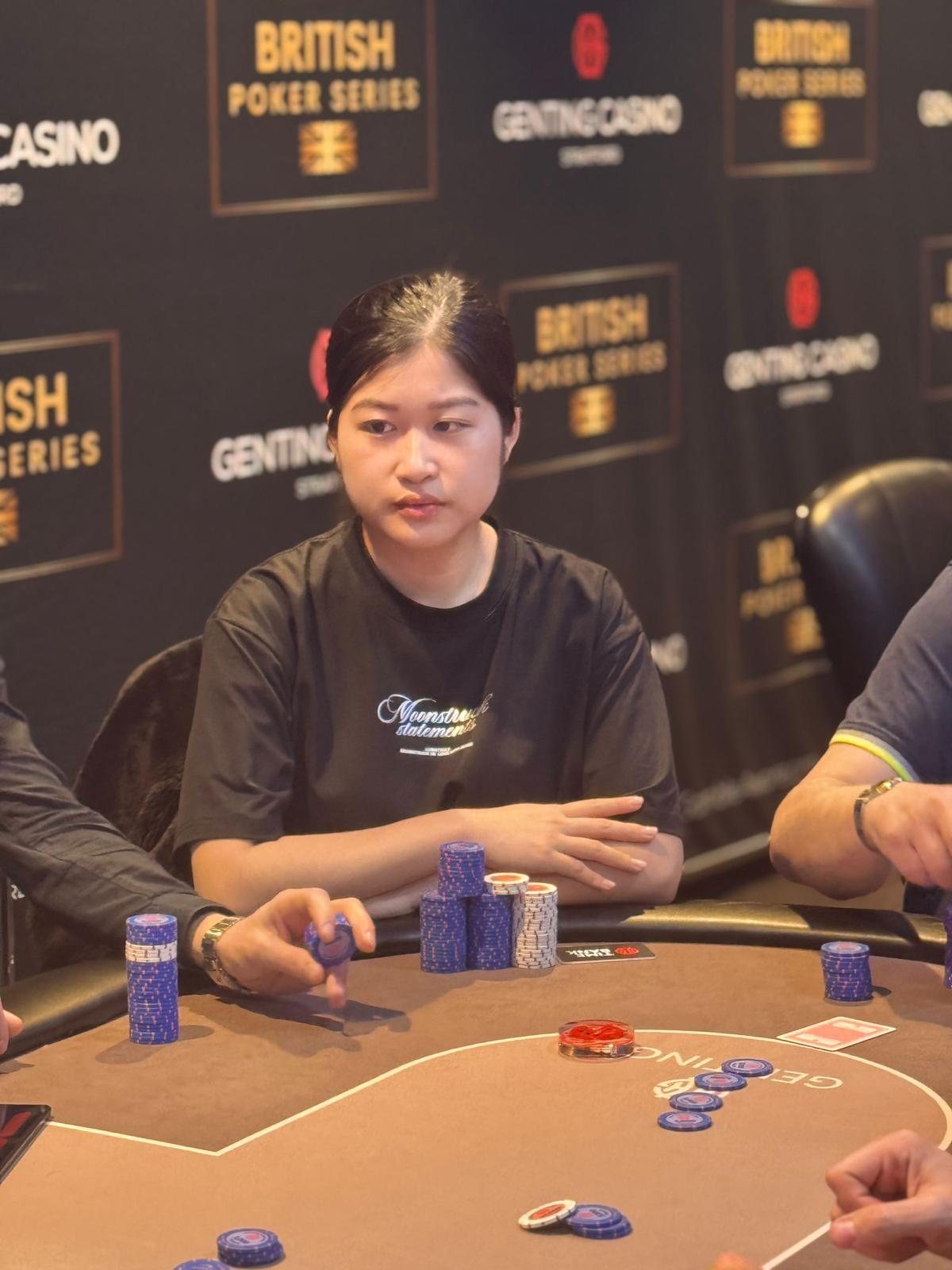 BPS Ladies player with chips against a British Poker Series backdrop