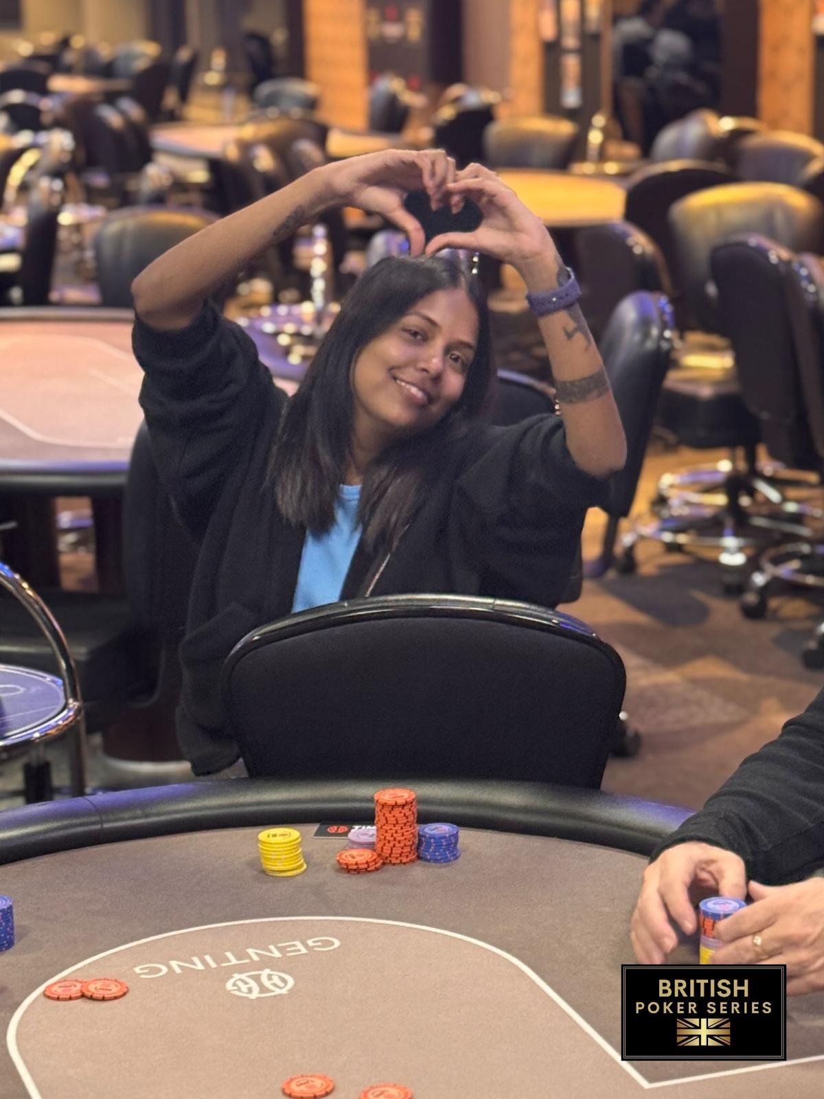BPS Ladies player making a heart gesture at the table
