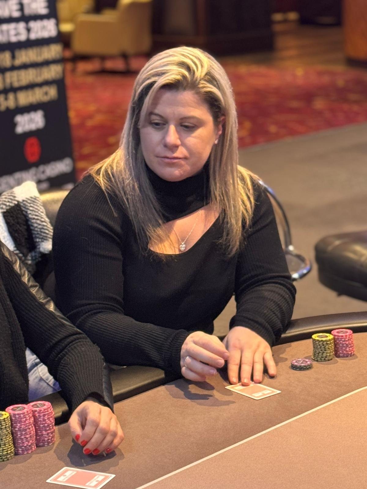 BPS Ladies player seated with chips during tournament play