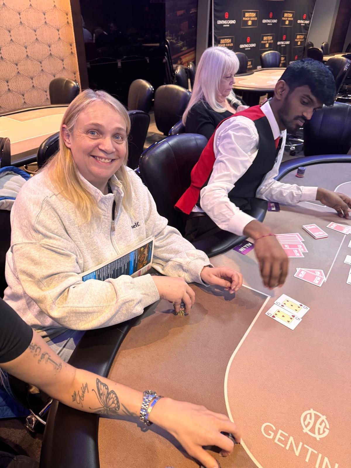 BPS Ladies player smiling during a dealt hand